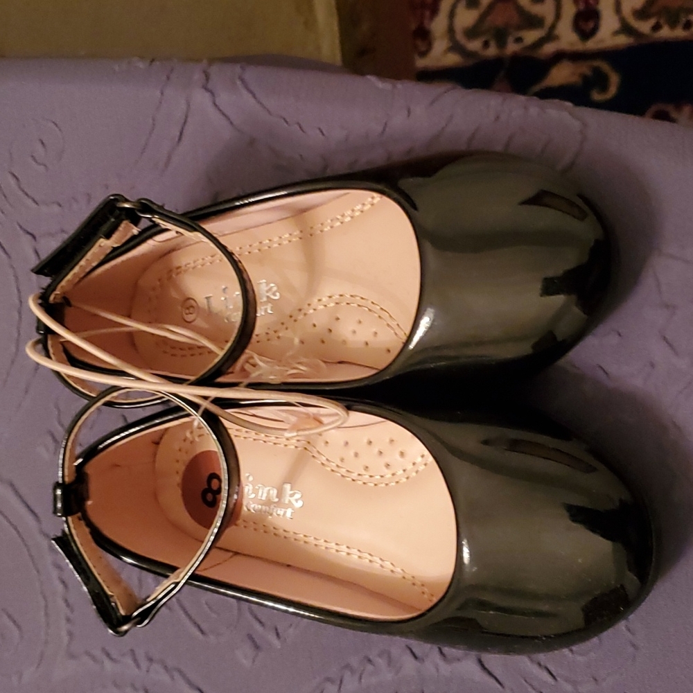 Black patent leather shoes with ankle closure